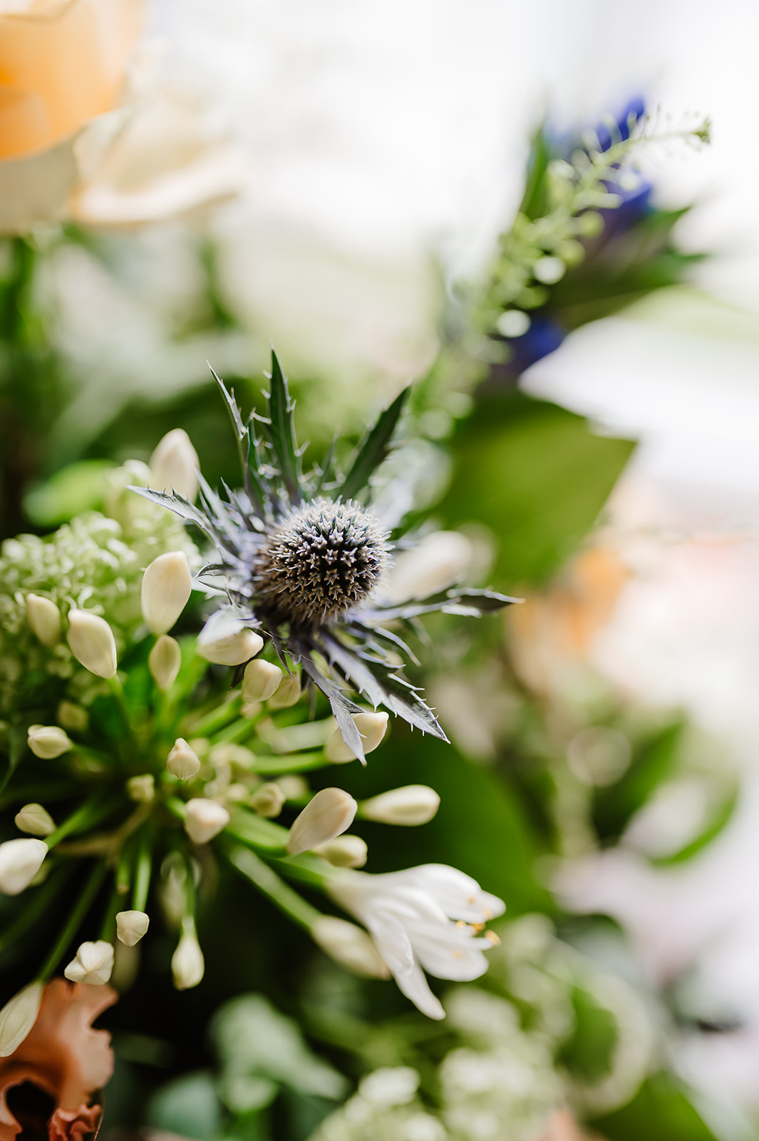 Bridal flowers with thistle