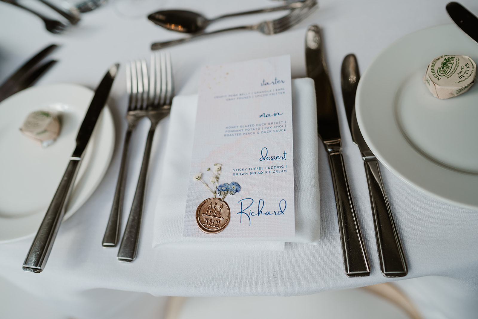 Place setting and menu on table