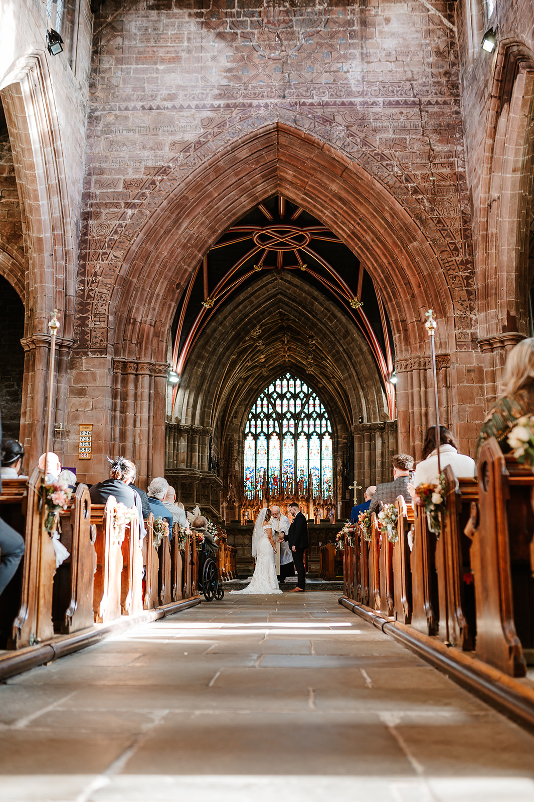 View down aisle in church during ceremony
