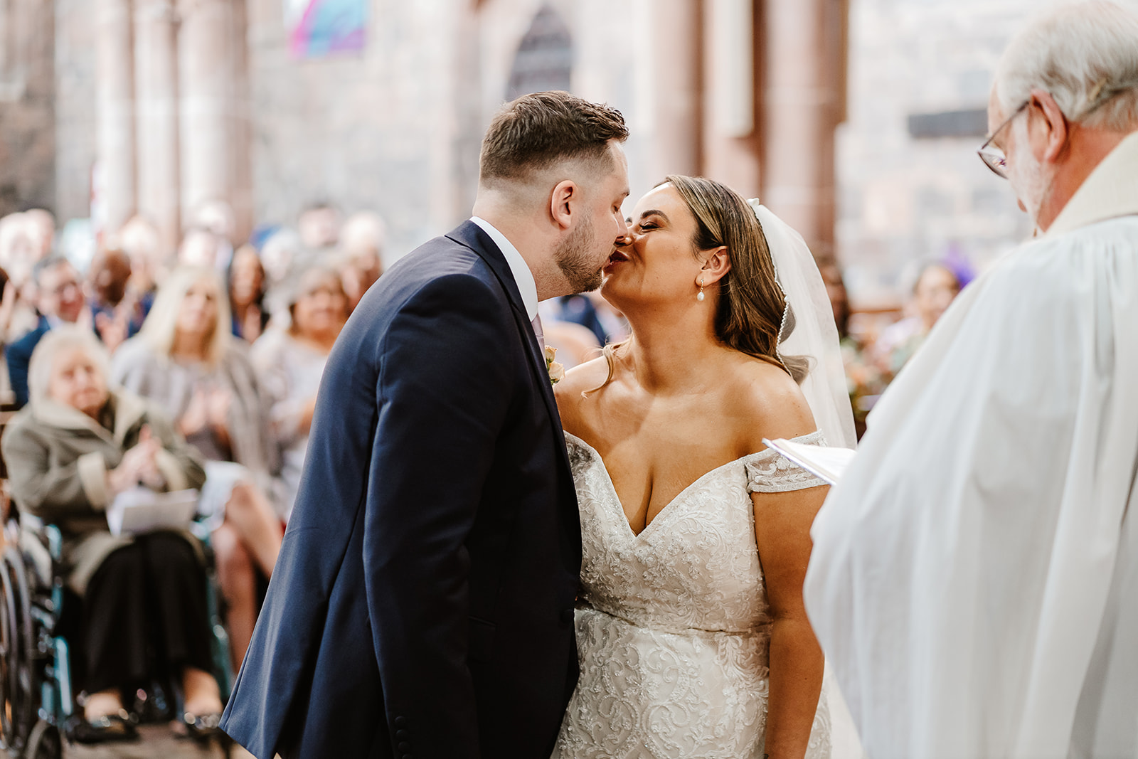 Bride and groom share first kiss