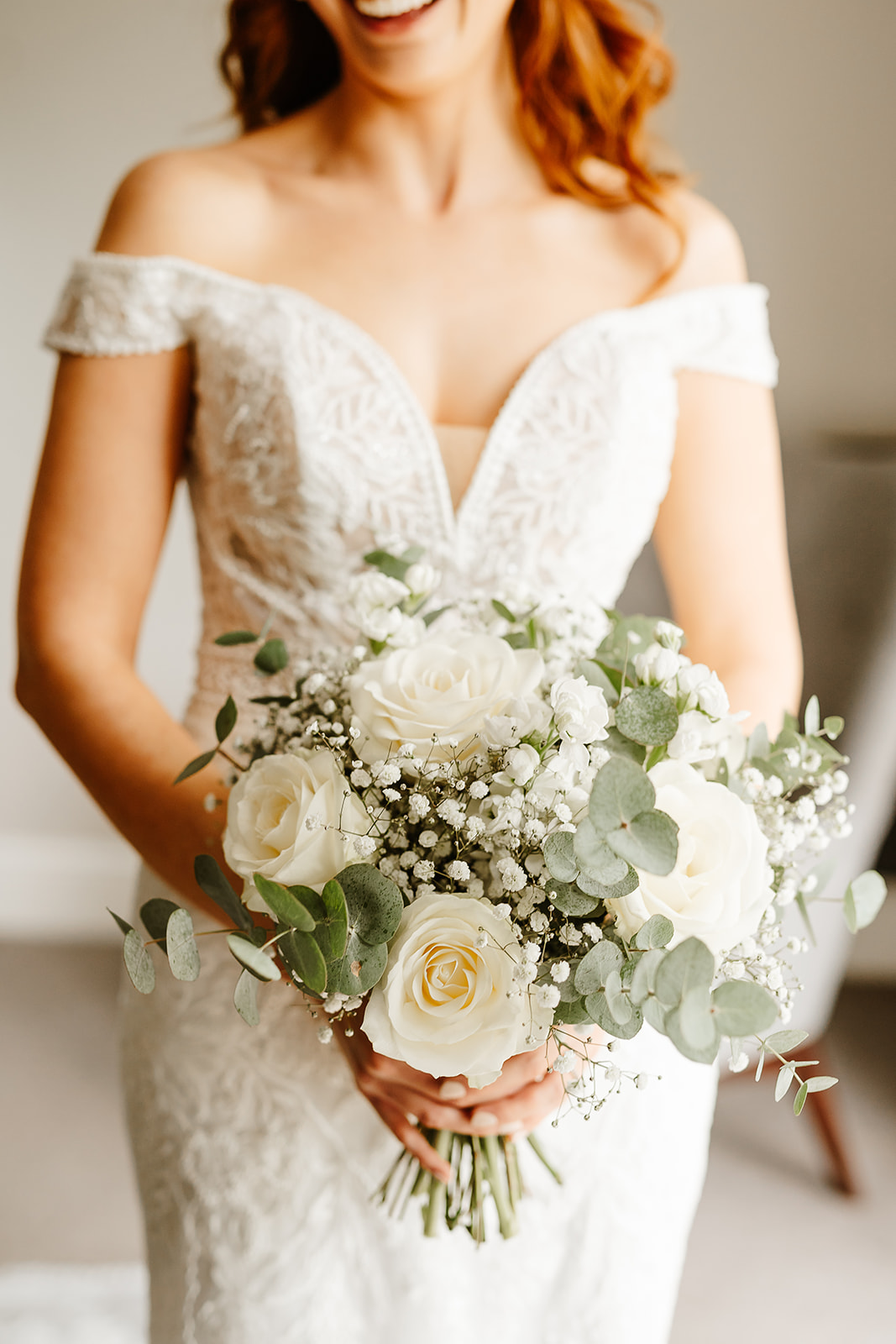 Bride holding bouquet at waist